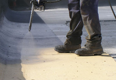Coating systems over Flint spray foam roof systems